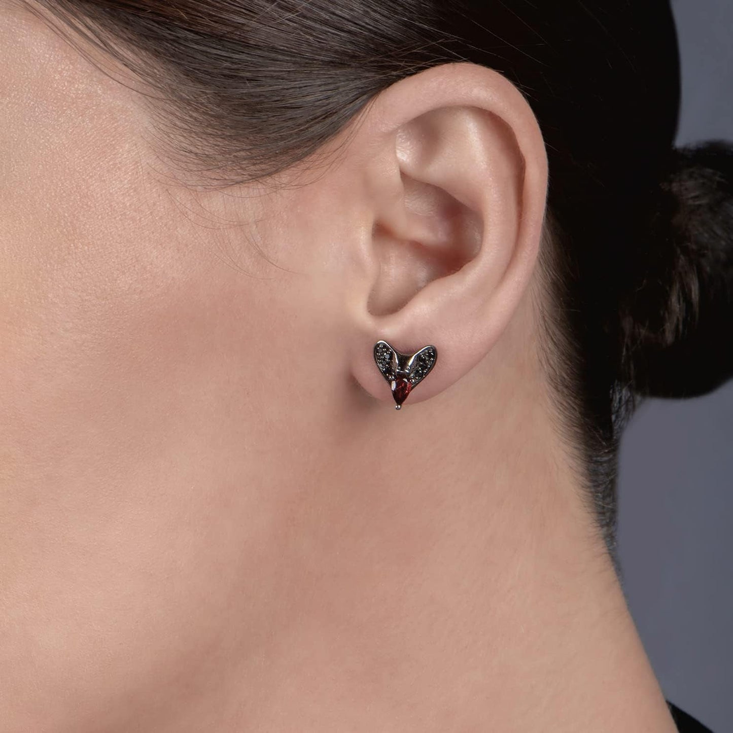 Enchanted Disney Fine Jewelry Black Rhodium over Sterling Silver 5X3 MM Pear Red Garnet and 1/8 Cttw Treated Black round Diamond Jafar Stud Earrings
