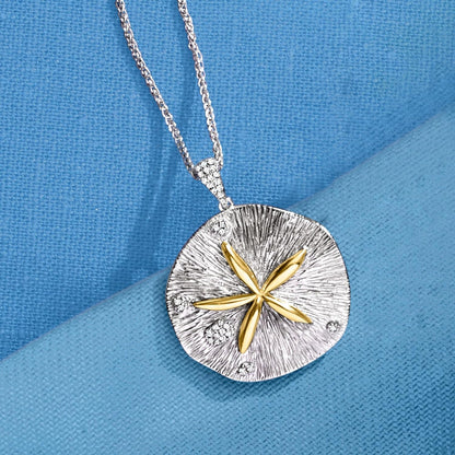 0.10 Ct. T.W. Diamond Sand Dollar Necklace in Sterling Silver and 14Kt Yellow Gold