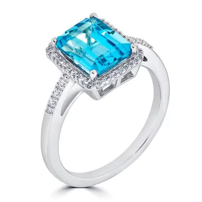 Blue Topaz and 0.14 CT. T.W. Diamond Ring in Sterling Silver